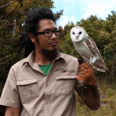 Goatee Toni holds an Australian barn owl